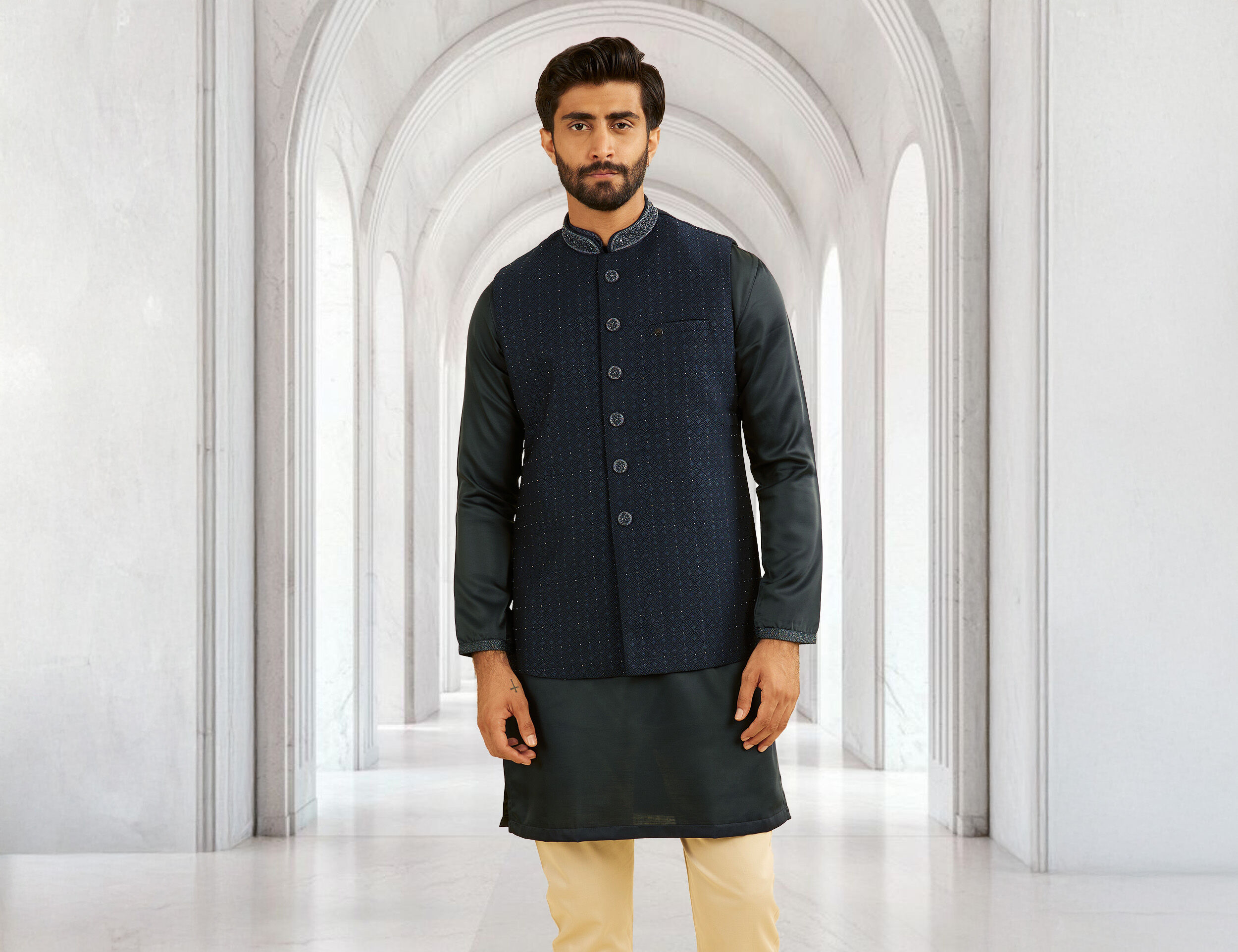Man wearing black kurta pajama with jacket